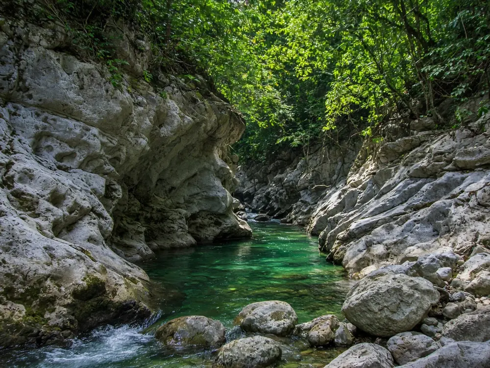 Limestone canyon with clear river pools near Labuan Bajo, Flores, similar to Cunca Wulang waterfall gorge